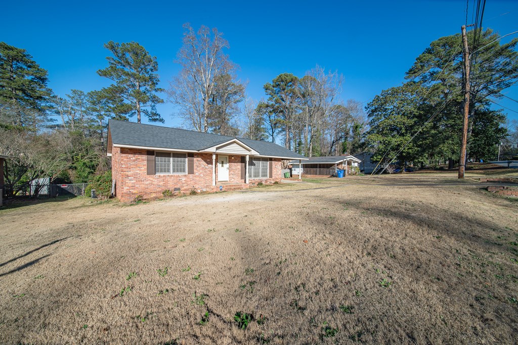 6411 Michael Avenue Columbus, GA 31909 - Photo 2 of 34 a view of an house with backyard space and garden