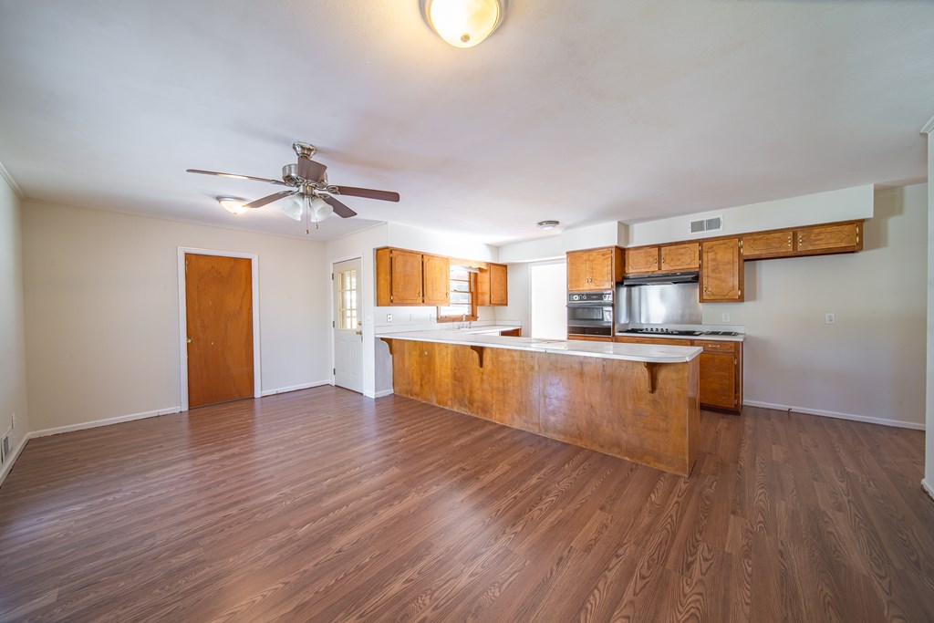 6411 Michael Avenue Columbus, GA 31909 - Photo 21 of 34 a kitchen with stainless steel appliances granite countertop a sink and cabinets