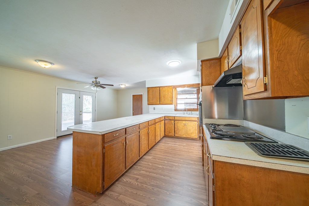 6411 Michael Avenue Columbus, GA 31909 - Photo 23 of 34 a kitchen with stainless steel appliances granite countertop a stove a sink and a refrigerator