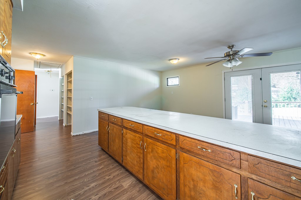 6411 Michael Avenue Columbus, GA 31909 - Photo 26 of 34 a hallway with wooden floor chandelier and entryway