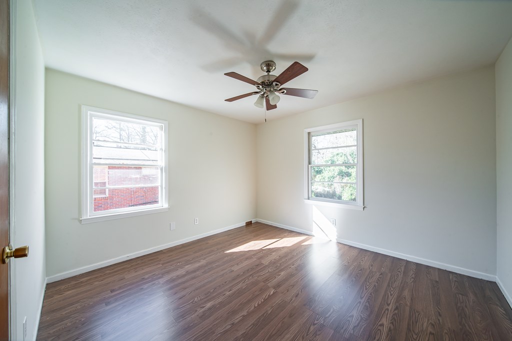 6411 Michael Avenue Columbus, GA 31909 - Photo 30 of 34 a view of an empty room with wooden floor and a window