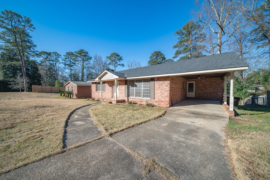 6411 Michael Avenue Columbus, GA 31909 - Photo 3 of 34 a view of a house with a yard and garage