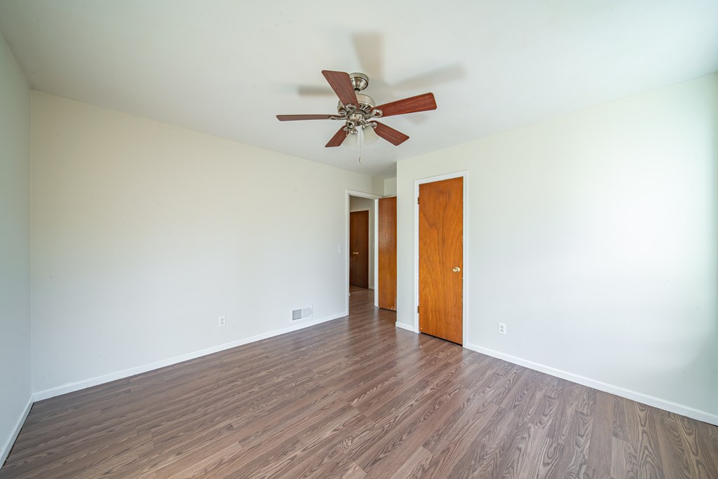 6411 Michael Avenue Columbus, GA 31909 - Photo 31 of 34 a view of a room with wooden floor and a ceiling fan