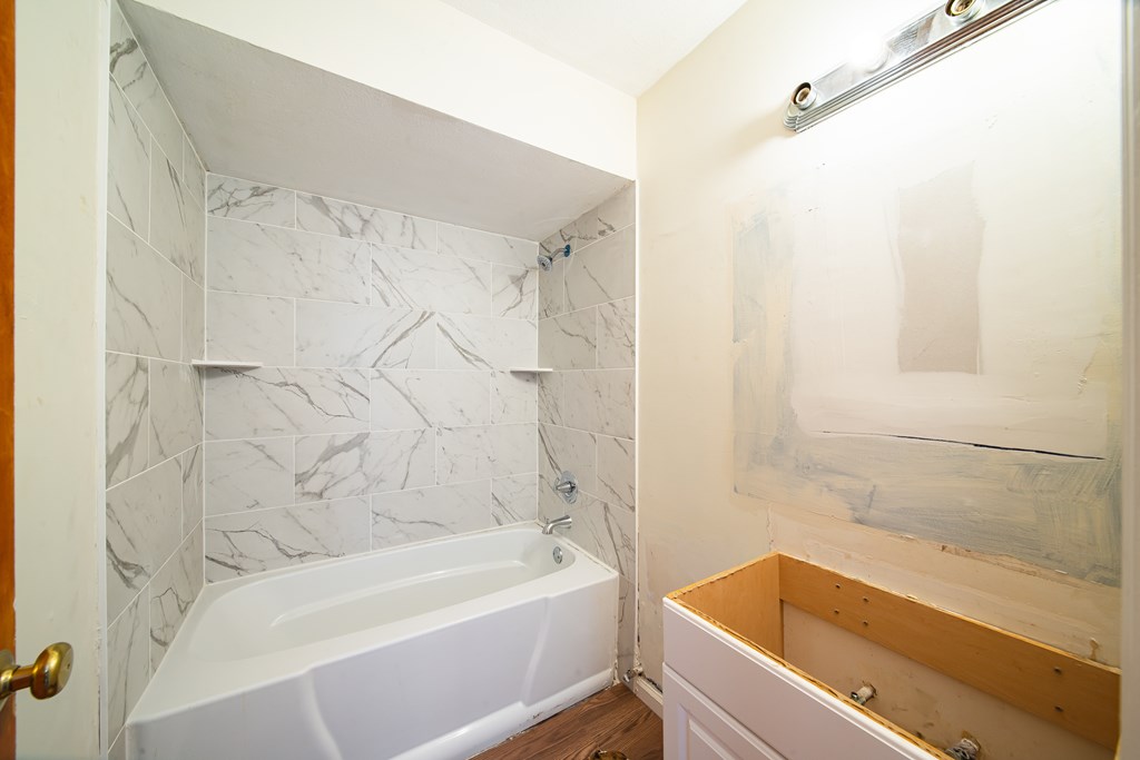 6411 Michael Avenue Columbus, GA 31909 - Photo 32 of 34 a bathroom with a bathtub and a shower