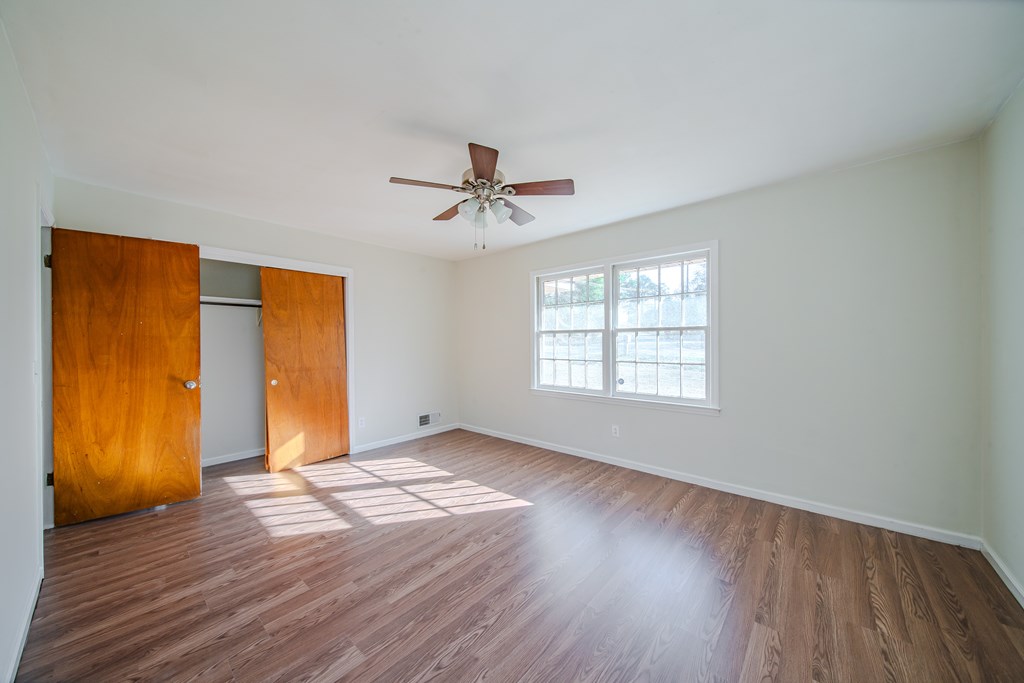 6411 Michael Avenue Columbus, GA 31909 - Photo 33 of 34 a view of an empty room with window and wooden floor