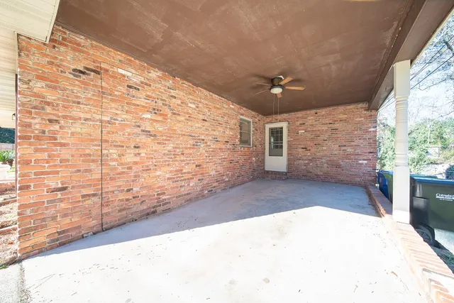 a view of an empty room and a window
