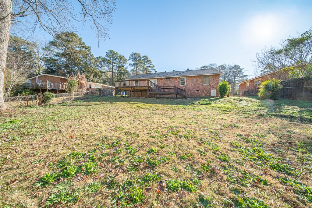 6411 Michael Avenue Columbus, GA 31909 - Photo 8 of 34 a backyard of a house with large trees and outdoor seating