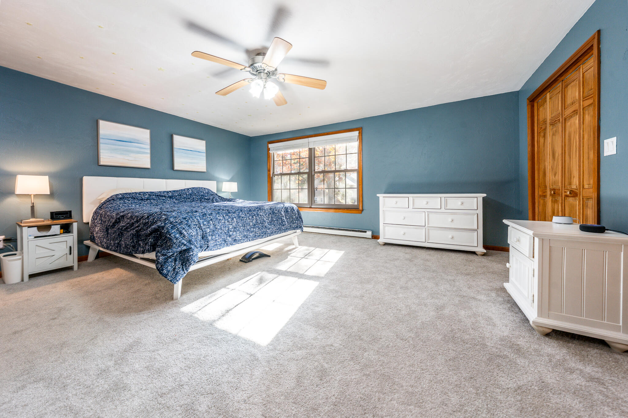 195 Falmouth Road, Unit 9D Mashpee, MA 02649 - Photo 14 of 36 a spacious bedroom with a bed and window