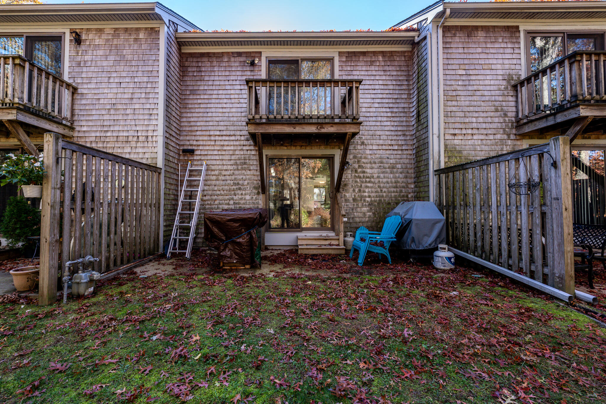 195 Falmouth Road, Unit 9D Mashpee, MA 02649 - Photo 29 of 36 a view of an house with backyard space and deck