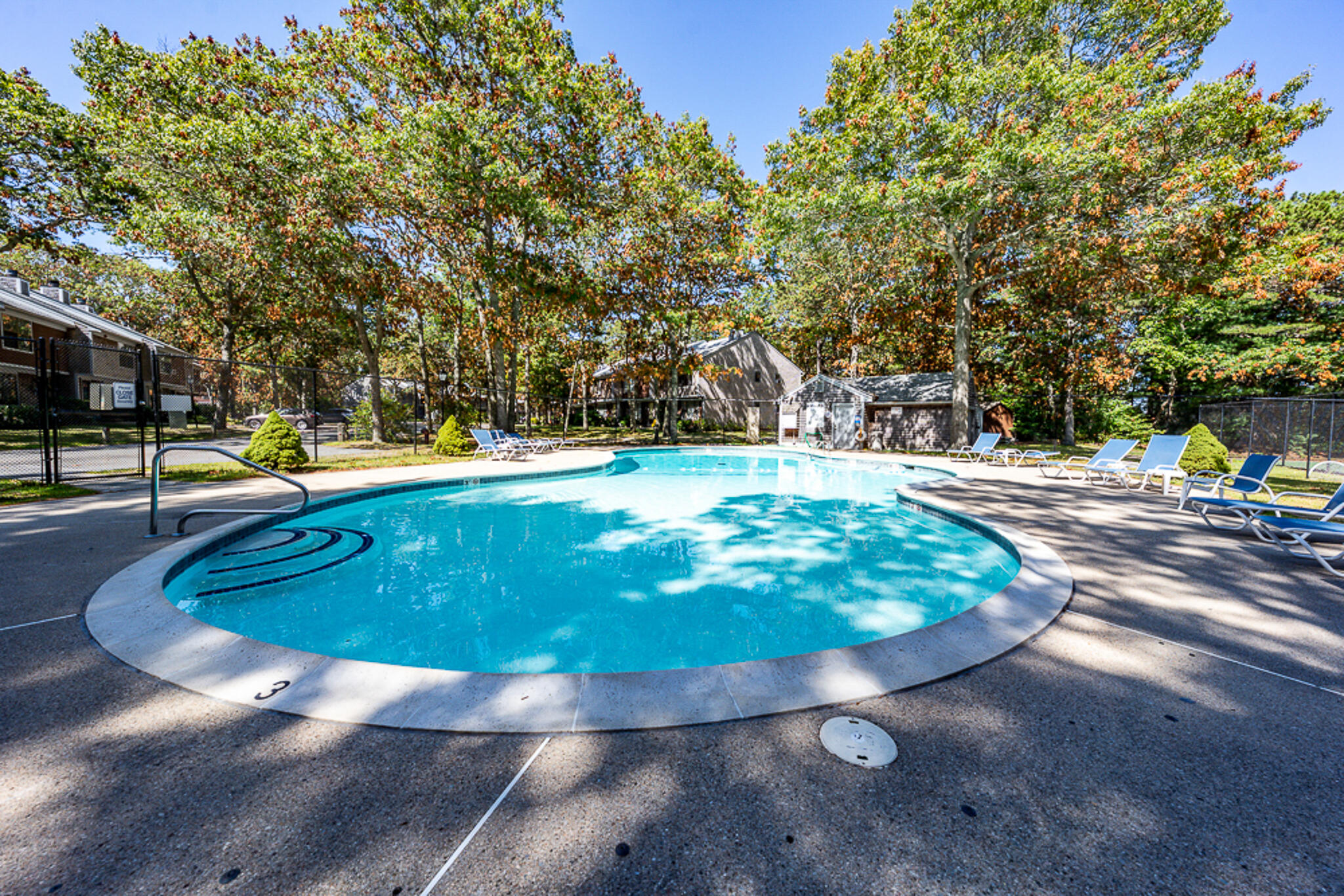 195 Falmouth Road, Unit 9D Mashpee, MA 02649 - Photo 31 of 36 a view of a swimming pool with an outdoor space