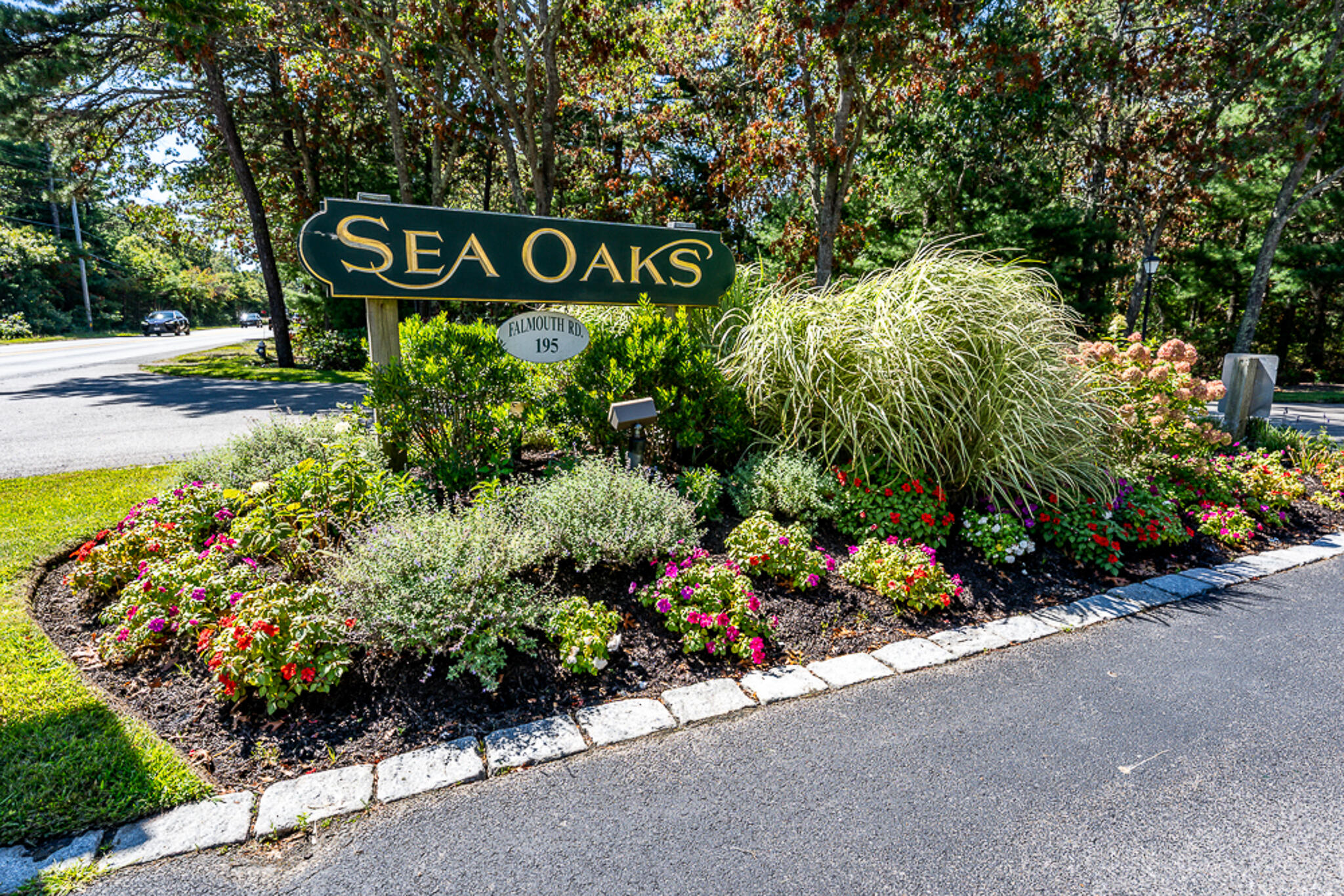 195 Falmouth Road, Unit 9D Mashpee, MA 02649 - Photo 32 of 36 a view of sign board with plants