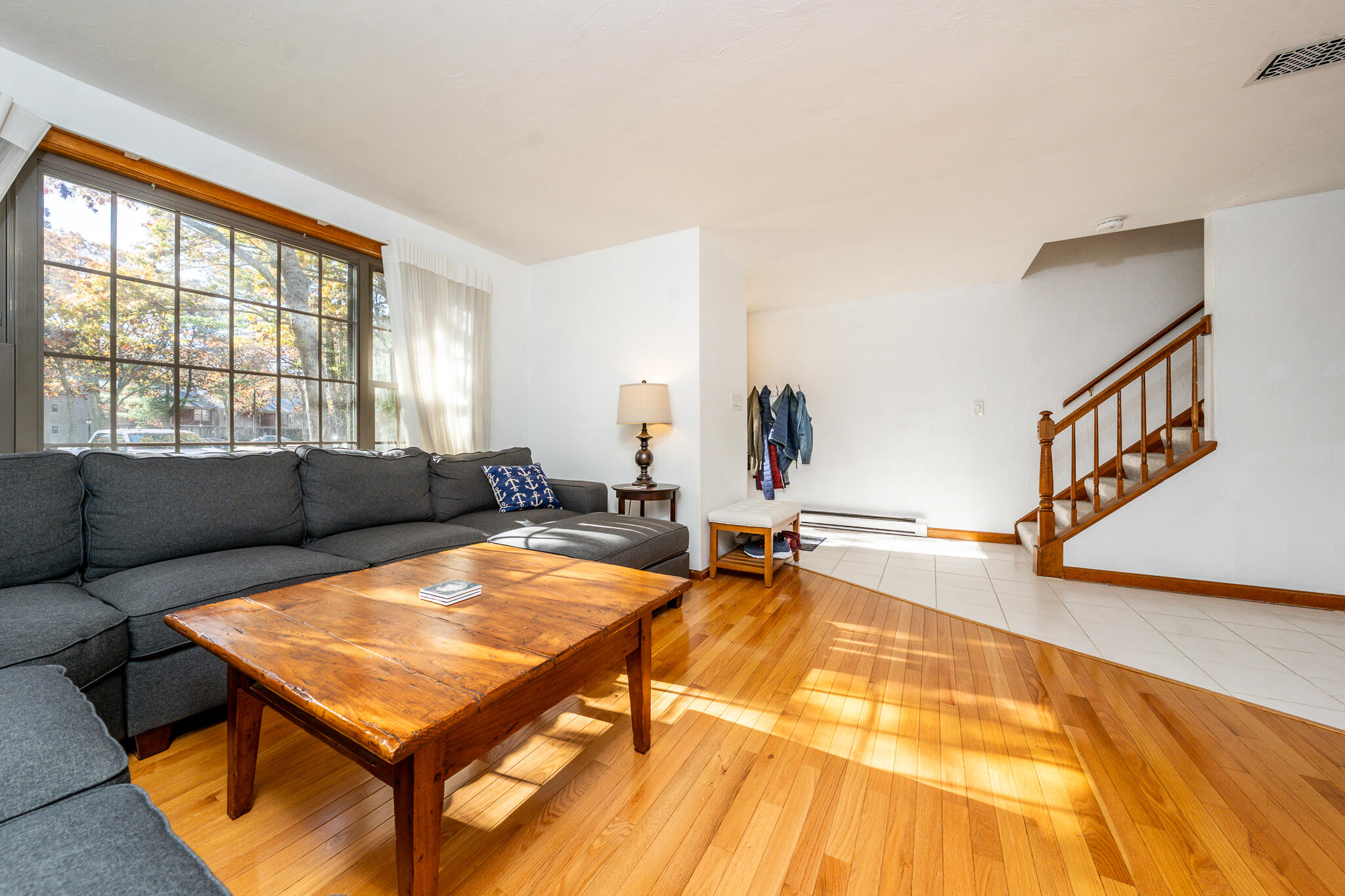 195 Falmouth Road, Unit 9D Mashpee, MA 02649 - Photo 5 of 36 a living room with a pool table and a couch