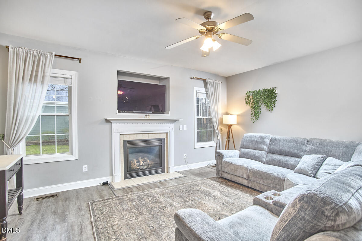 3821 La Costa Way Raleigh, NC 27610 - Photo 12 of 45 a living room with furniture and a fireplace