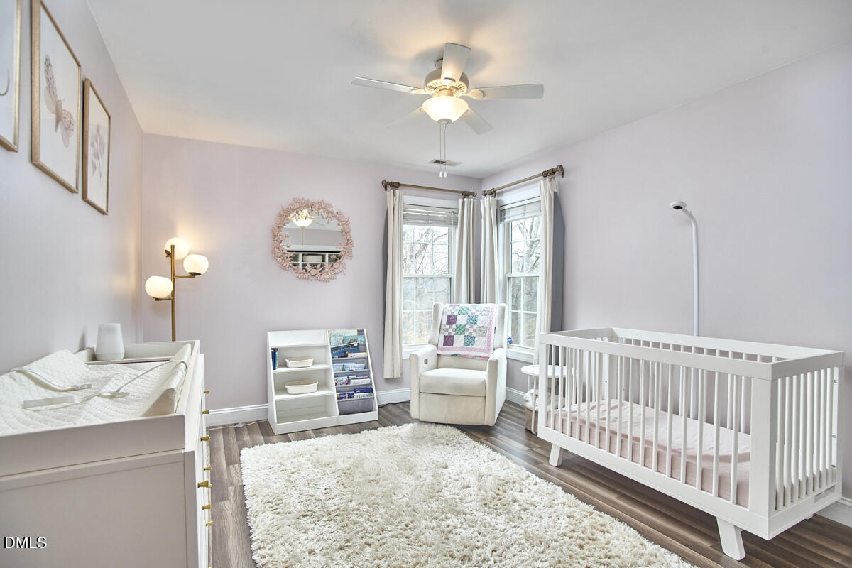3821 La Costa Way Raleigh, NC 27610 - Photo 22 of 45 a living room with furniture and a baby crib