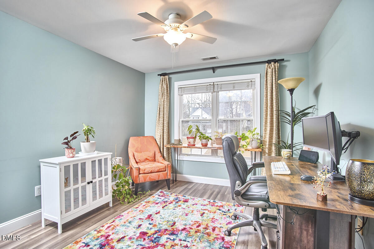 3821 La Costa Way Raleigh, NC 27610 - Photo 24 of 45 a living room with furniture and a table
