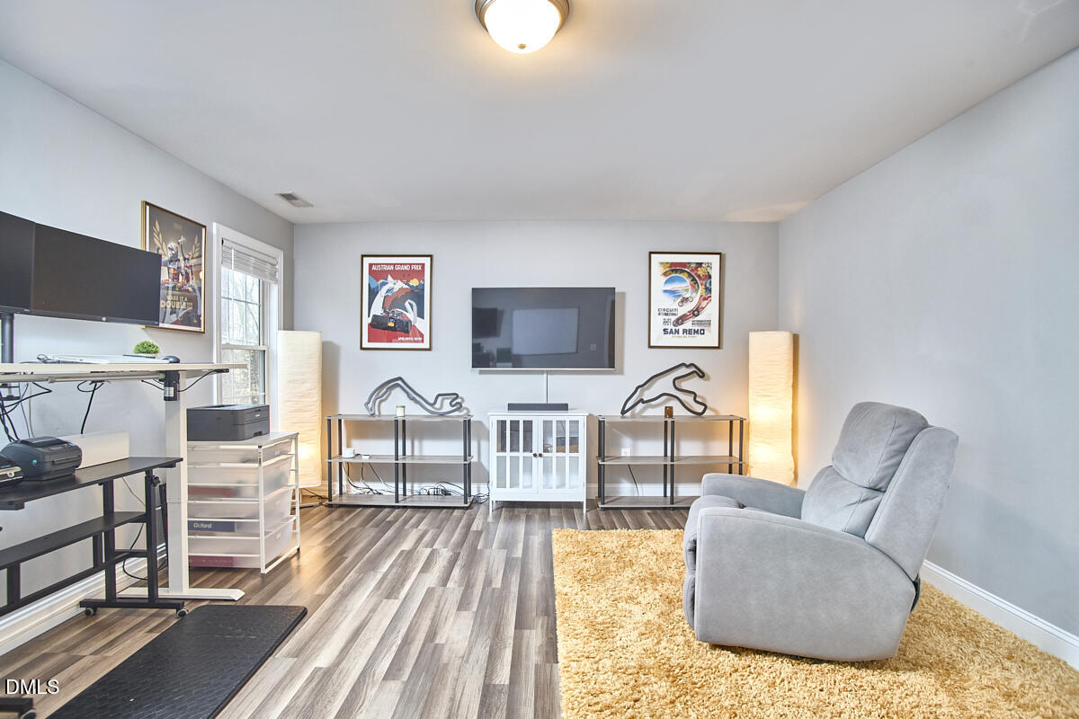 3821 La Costa Way Raleigh, NC 27610 - Photo 26 of 45 a living room with furniture and a flat screen tv