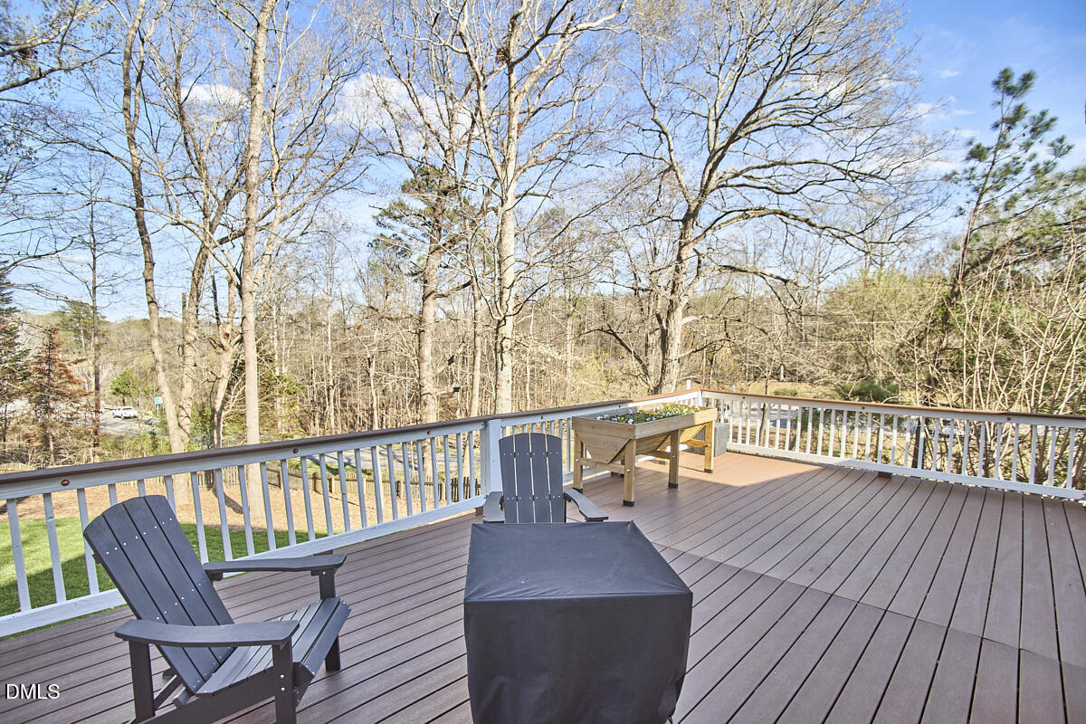 3821 La Costa Way Raleigh, NC 27610 - Photo 33 of 45 a view of a balcony with wooden floor and bench