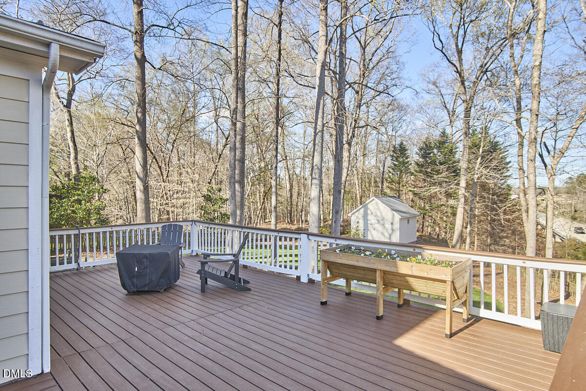 3821 La Costa Way Raleigh, NC 27610 - Photo 34 of 45 a view of a chair and tables on the deck