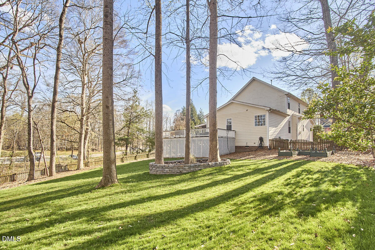 3821 La Costa Way Raleigh, NC 27610 - Photo 37 of 45 a view of a house with backyard and a tree