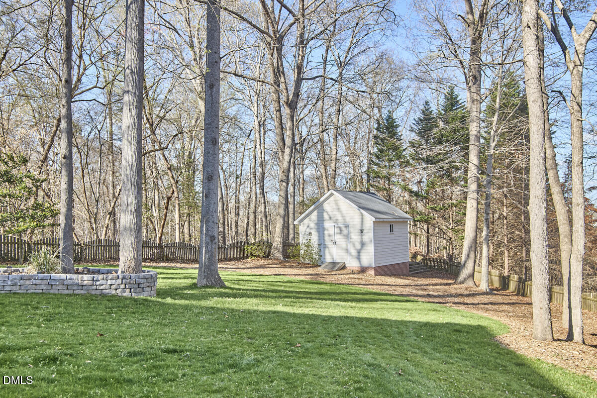 3821 La Costa Way Raleigh, NC 27610 - Photo 39 of 45 a front view of a house with a garden
