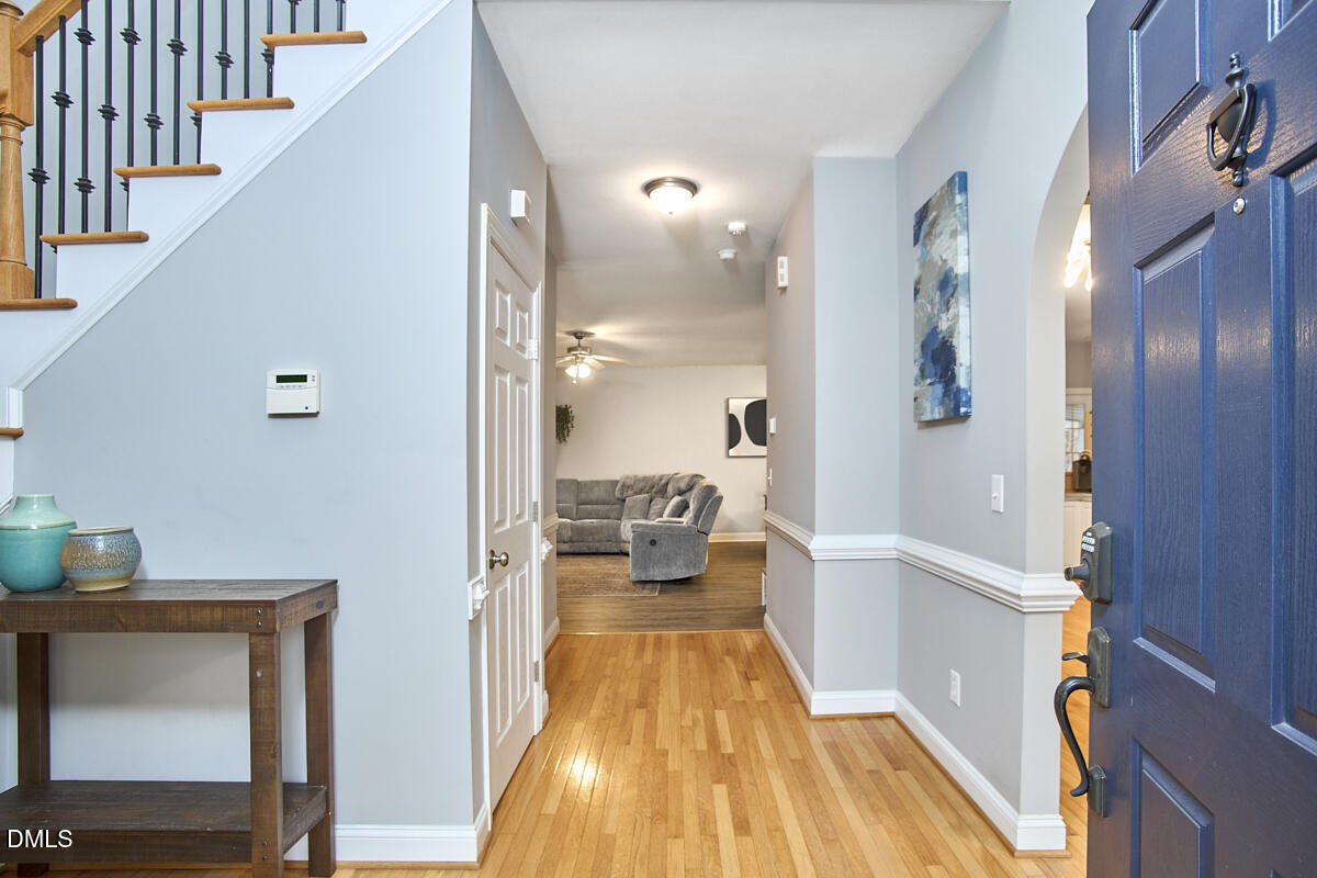 3821 La Costa Way Raleigh, NC 27610 - Photo 4 of 45 a view of a living room with a fireplace and wooden floor