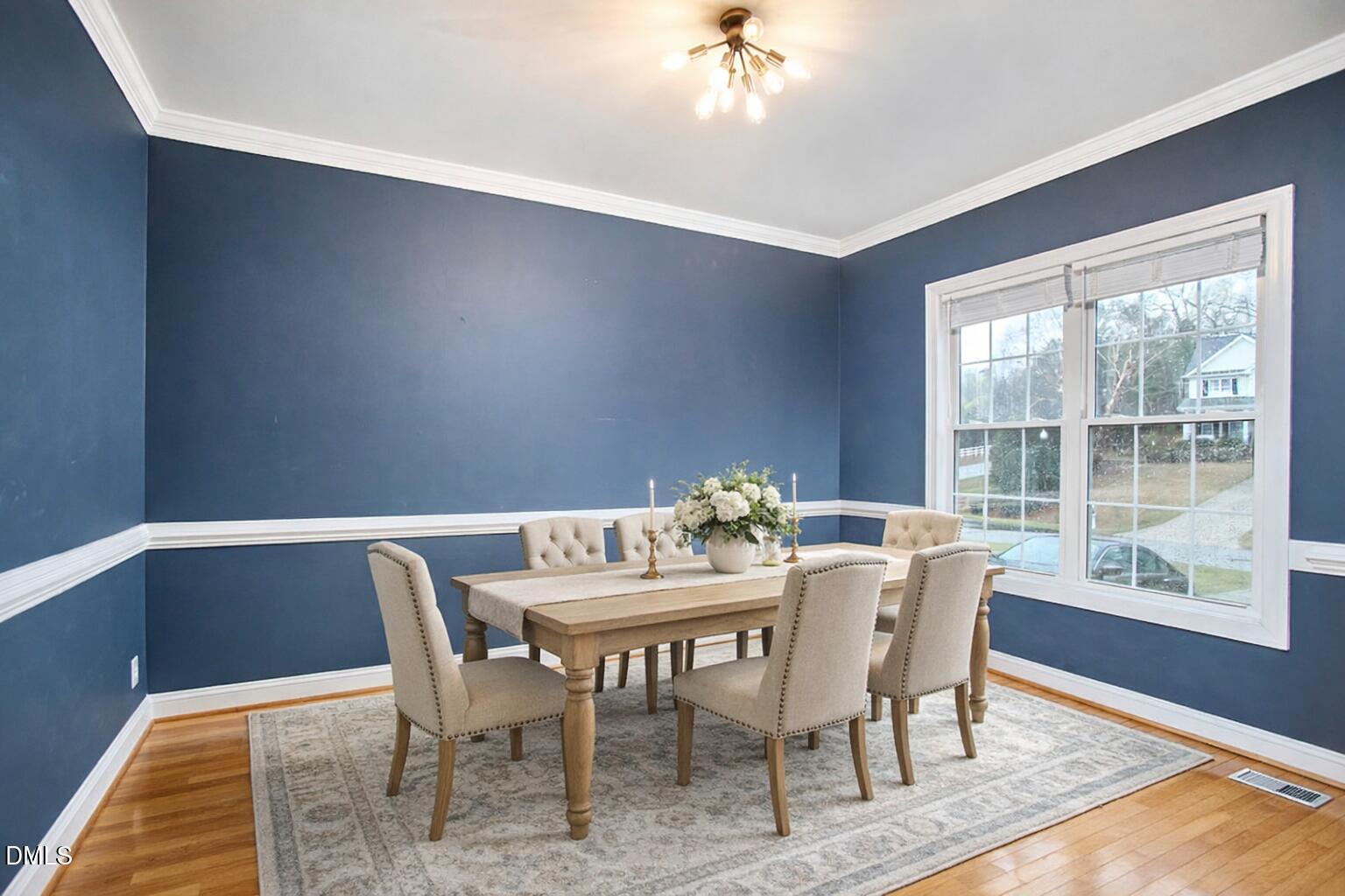 3821 La Costa Way Raleigh, NC 27610 - Photo 7 of 45 a view of a dining room with furniture window and wooden floor