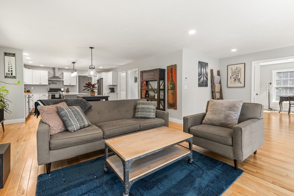 62 Benjamin Road Shirley, MA 01464 - Photo 11 of 37 a living room with furniture a couch and kitchen view