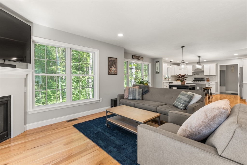 62 Benjamin Road Shirley, MA 01464 - Photo 13 of 37 a living room with furniture and a flat screen tv