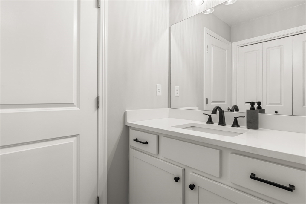 62 Benjamin Road Shirley, MA 01464 - Photo 19 of 37 a bathroom with a sink and a mirror