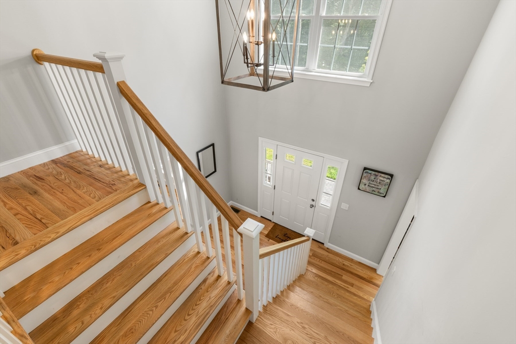 62 Benjamin Road Shirley, MA 01464 - Photo 32 of 37 a view of entryway and hall with wooden floor
