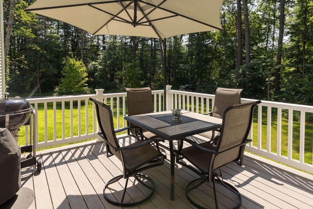 62 Benjamin Road Shirley, MA 01464 - Photo 36 of 37 a view of a chair and table on the deck