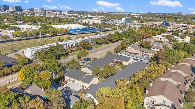 an aerial view of residential houses with outdoor space