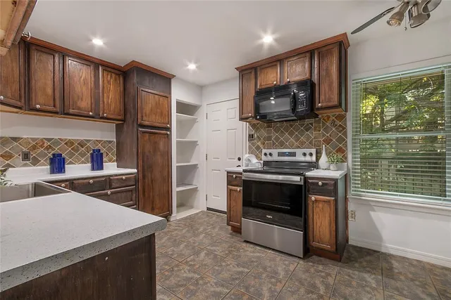 a kitchen with a stove and a microwave