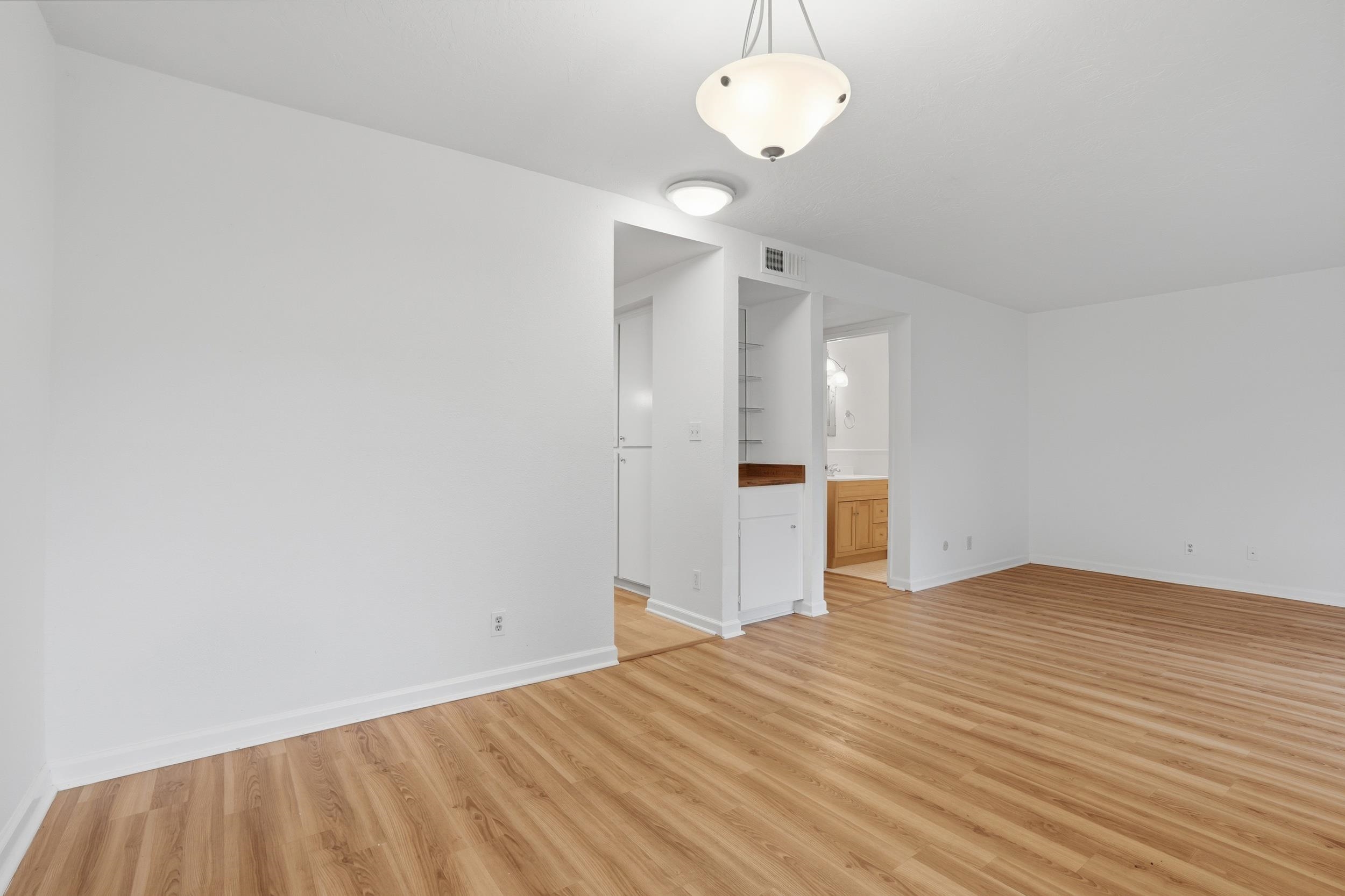 3401 Bermuda Avenue, Unit 6 Davis, CA 95616 - Photo 15 of 43 a view of empty room with wooden floor