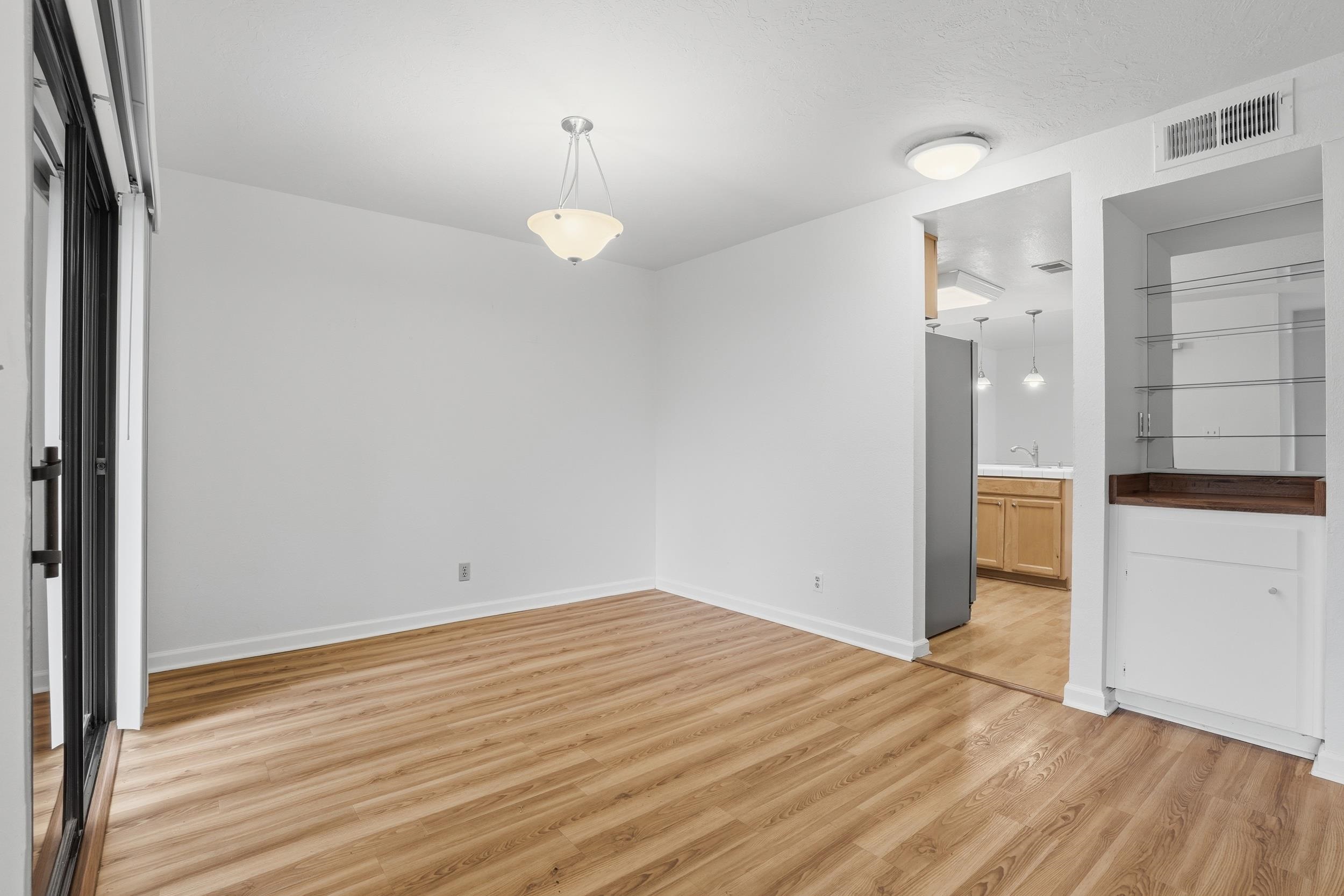 3401 Bermuda Avenue, Unit 6 Davis, CA 95616 - Photo 16 of 43 a view of empty room with wooden floor