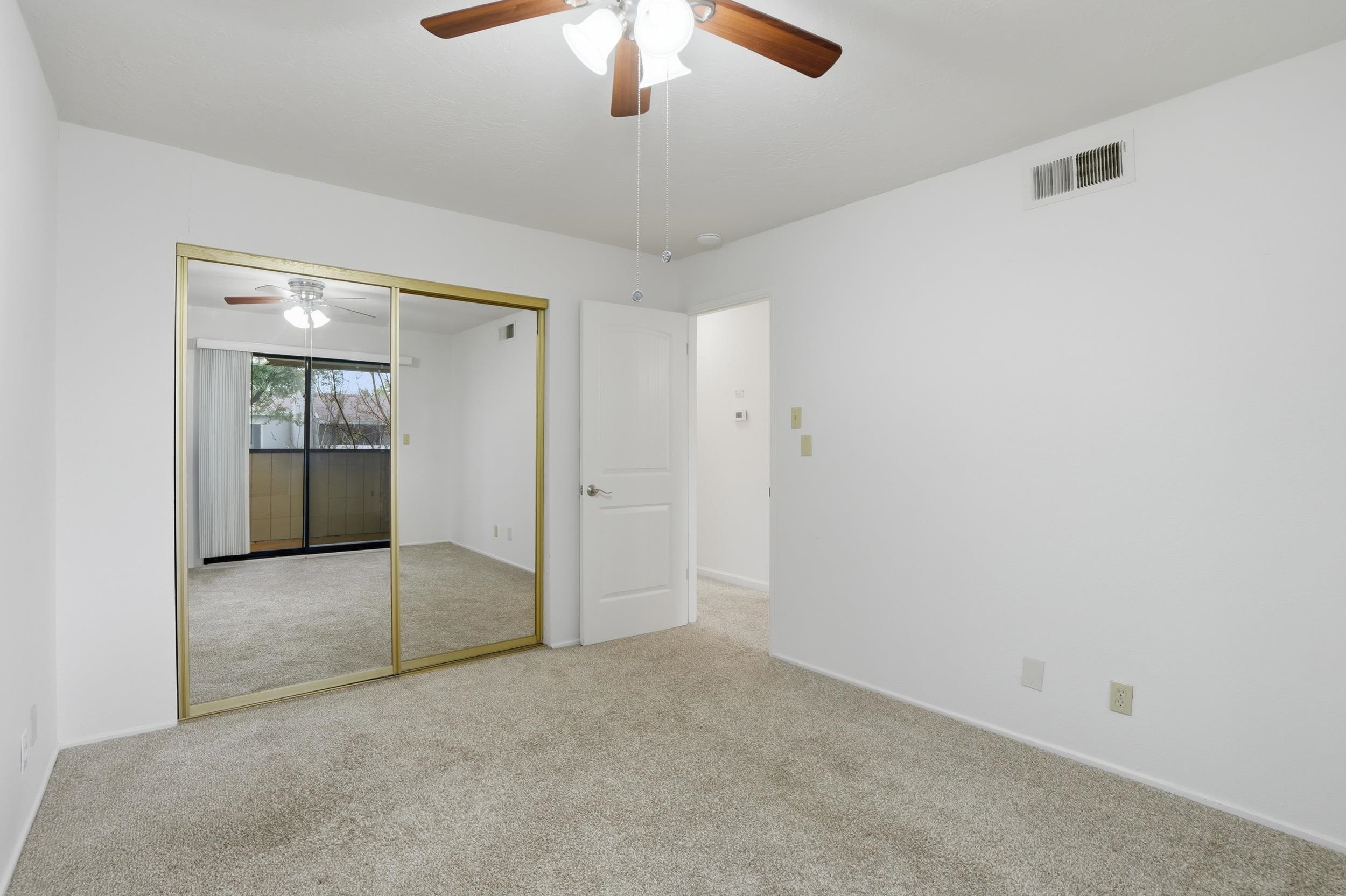 3401 Bermuda Avenue, Unit 6 Davis, CA 95616 - Photo 23 of 43 an empty room with fan and hallway