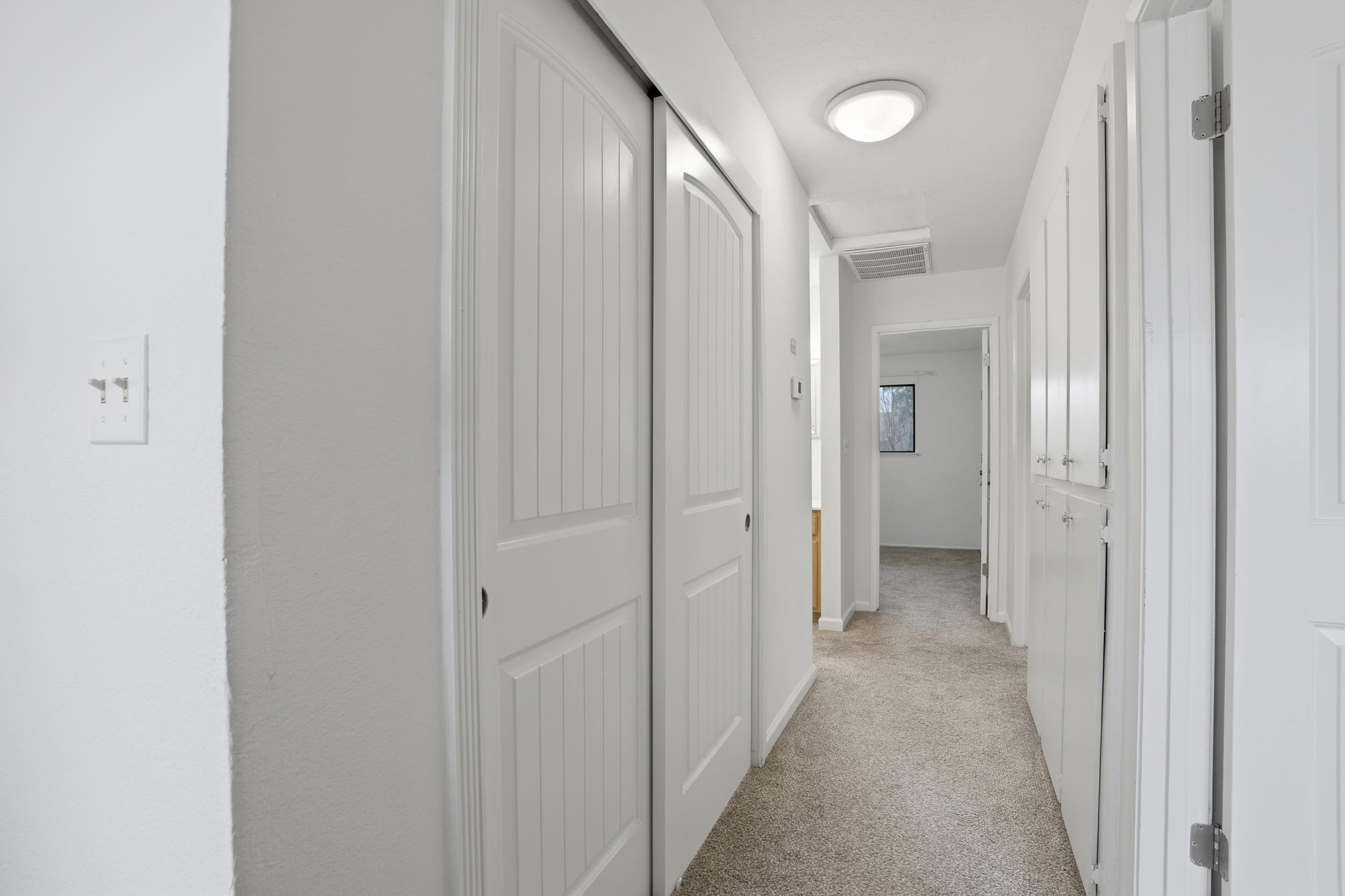 3401 Bermuda Avenue, Unit 6 Davis, CA 95616 - Photo 24 of 43 a view of a hallway with a wooden door
