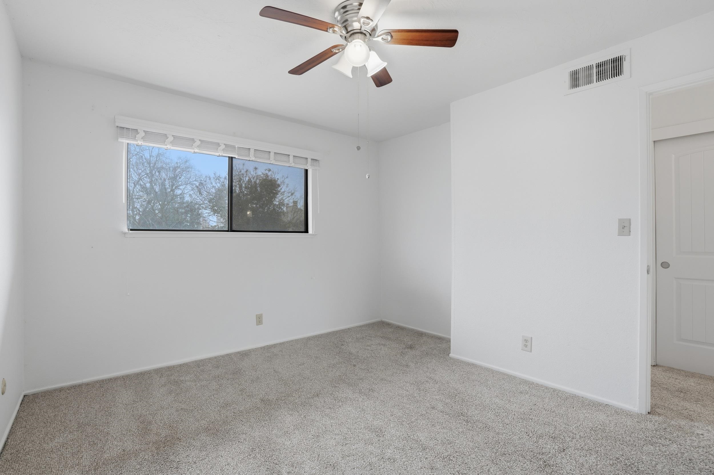 3401 Bermuda Avenue, Unit 6 Davis, CA 95616 - Photo 27 of 43 a view of a livingroom with a ceiling fan and window