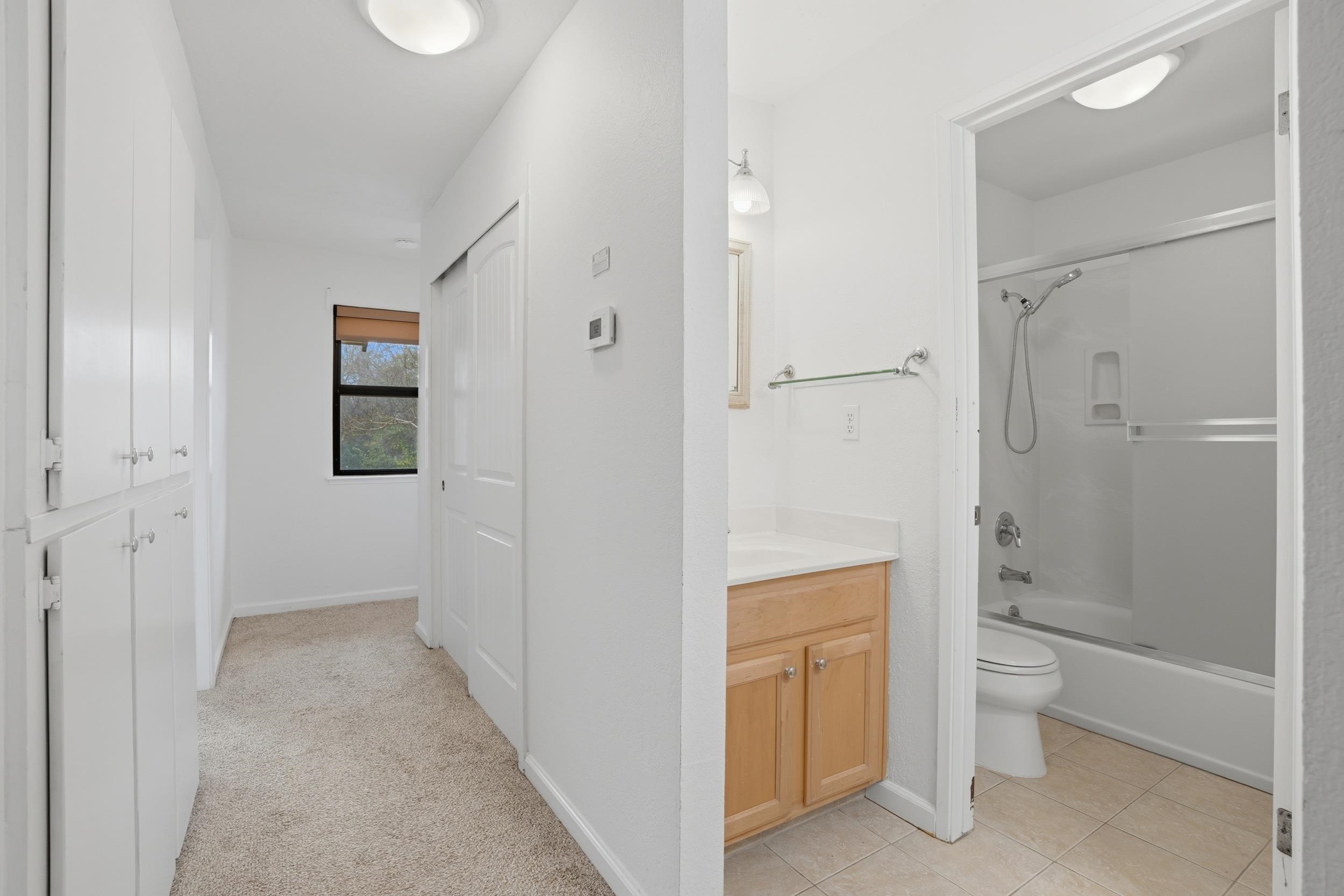 3401 Bermuda Avenue, Unit 6 Davis, CA 95616 - Photo 29 of 43 a bathroom with a granite countertop sink a toilet and shower