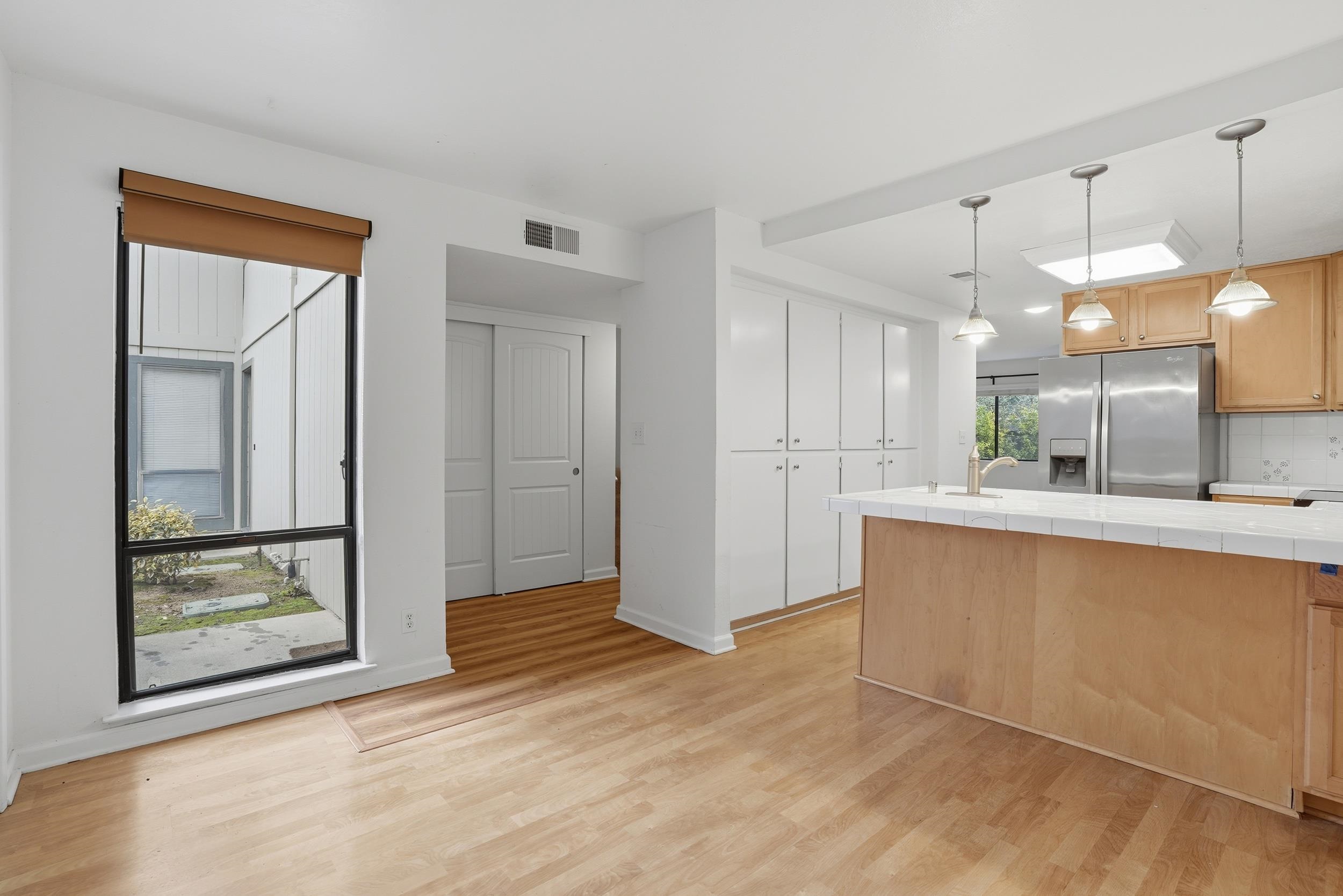 3401 Bermuda Avenue, Unit 6 Davis, CA 95616 - Photo 8 of 43 a view of kitchen with wooden floor and window