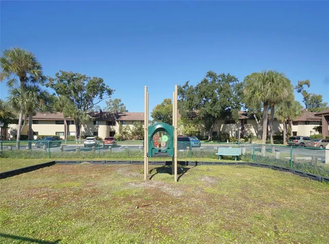 a view of a park with swings and slides