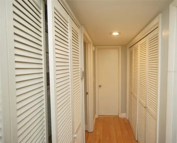 a view of a hallway with a bathroom