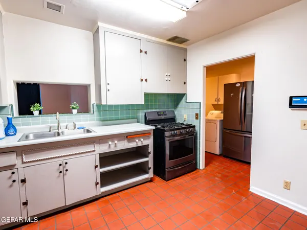 a view of a hallway with wooden floor and closet
