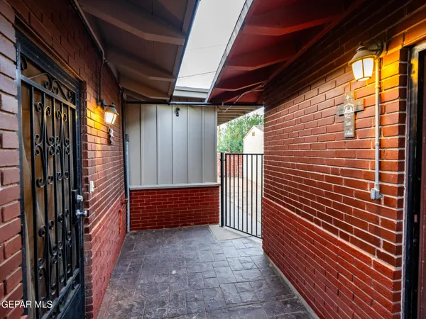 a view of a livingroom with wooden floor and a ceiling fan
