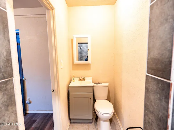 a bathroom with a shower and a sink