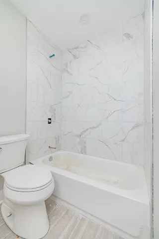 a bathroom with a white bath tub
