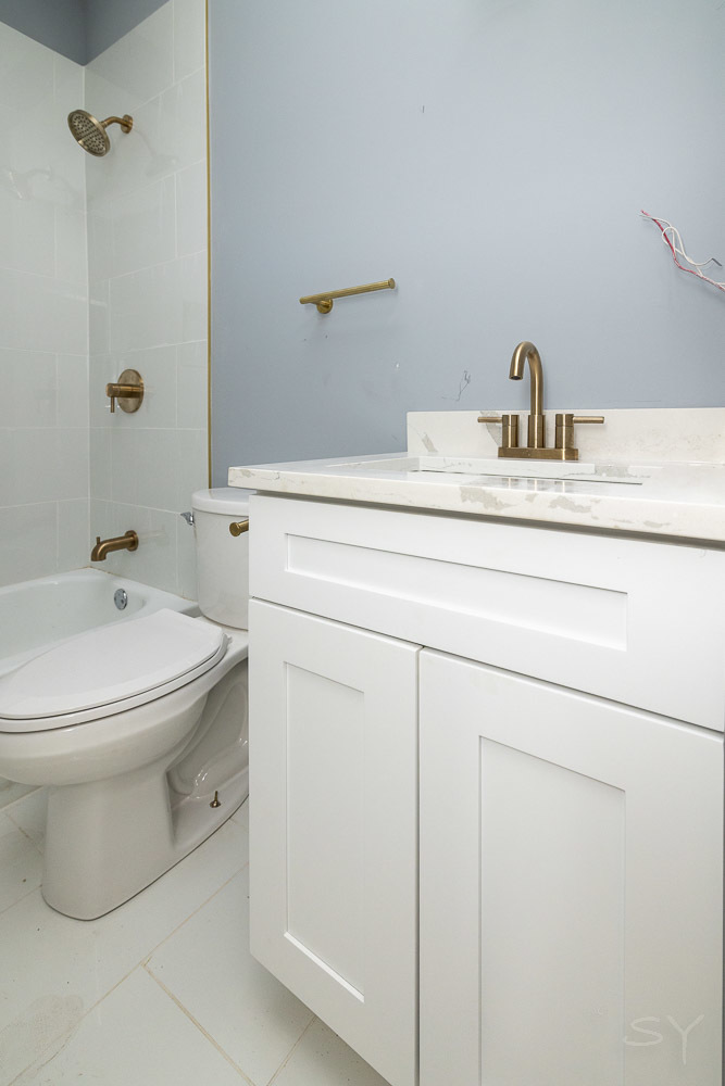 2450 South Oakley Avenue, Unit 2R Chicago, IL 60608 - Photo 8 of 9 a bathroom with a sink toilet and shower