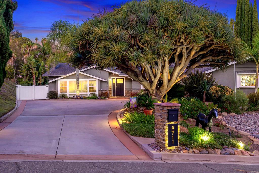 4711 Lorena Place El Cajon, CA 92020 - Photo 1 of 33 a front view of a house with garden