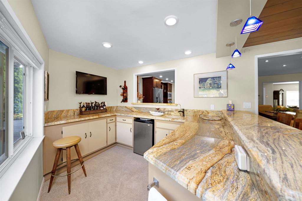 4711 Lorena Place El Cajon, CA 92020 - Photo 12 of 33 a large white kitchen with a large window