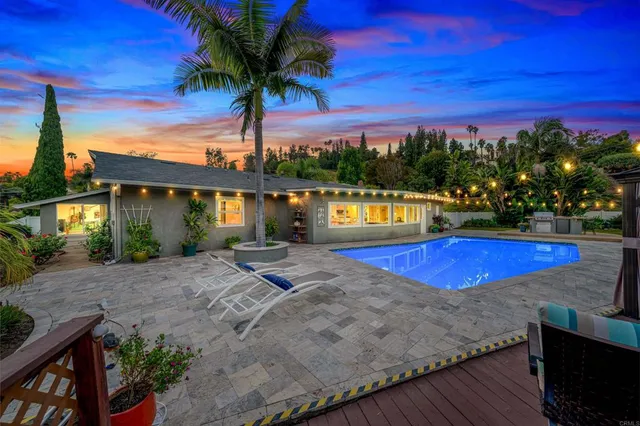 a view of a swimming pool with a lounge chairs